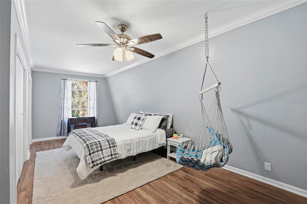 15024 Northwest 89th Street Alachua, FL 32615 - Photo 21 of 31 a bedroom with a bed and window