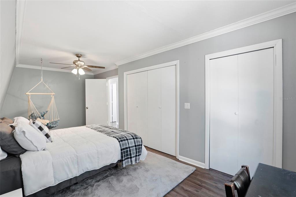15024 Northwest 89th Street Alachua, FL 32615 - Photo 22 of 31 a bedroom with a bed and wooden floor