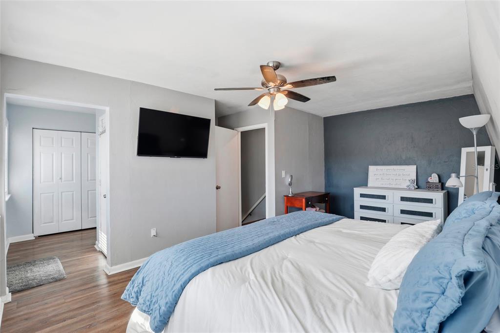 15024 Northwest 89th Street Alachua, FL 32615 - Photo 24 of 31 a bedroom with a bed and a flat screen tv