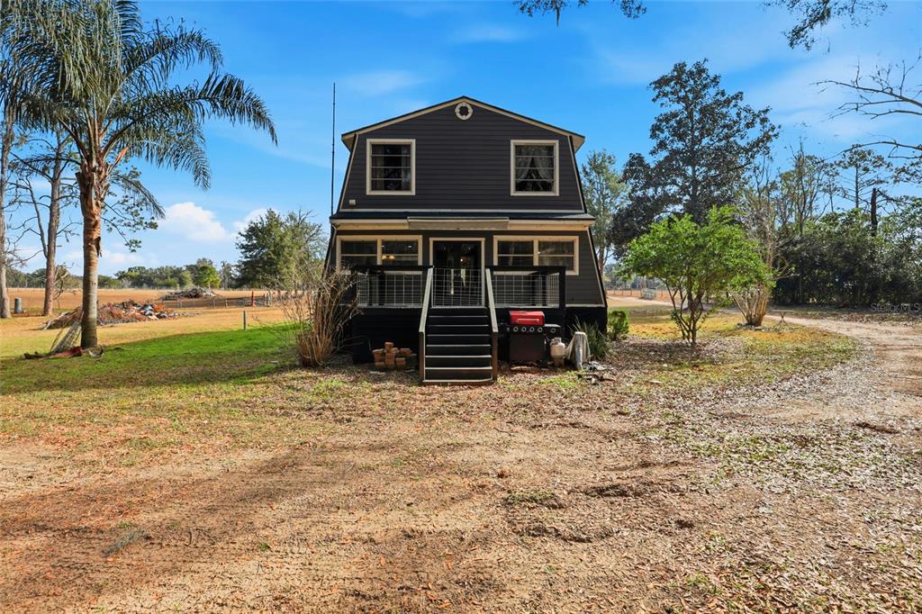 15024 Northwest 89th Street Alachua, FL 32615 - Photo 29 of 31 a front view of a house with a yard