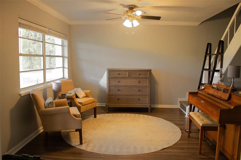 15024 Northwest 89th Street Alachua, FL 32615 - Photo 5 of 16 a view of a workspace with furniture and a window