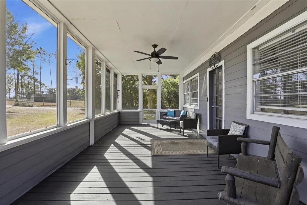 15024 Northwest 89th Street Alachua, FL 32615 - Photo 6 of 31 a living room with furniture and a large window