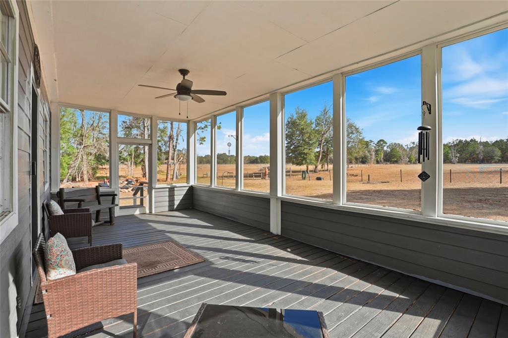15024 Northwest 89th Street Alachua, FL 32615 - Photo 7 of 31 a living room with furniture and a large window