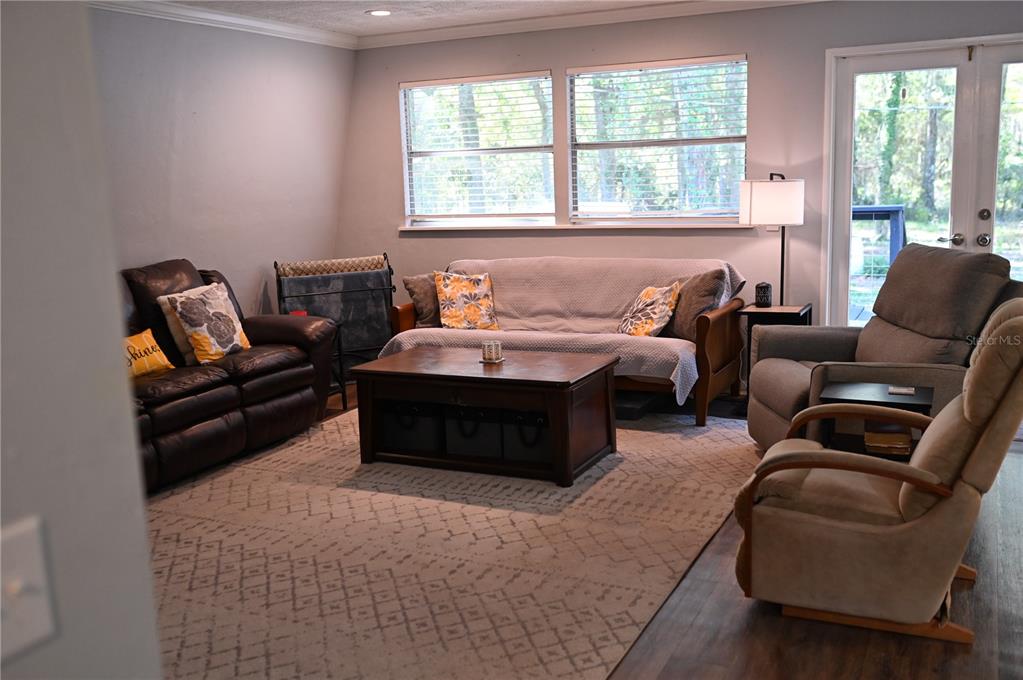 15024 Northwest 89th Street Alachua, FL 32615 - Photo 9 of 16 a bedroom with furniture and a large window
