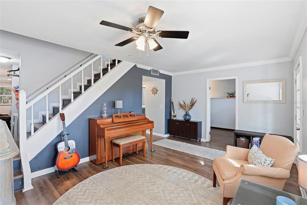 15024 Northwest 89th Street Alachua, FL 32615 - Photo 9 of 31 a living room with furniture and a piano