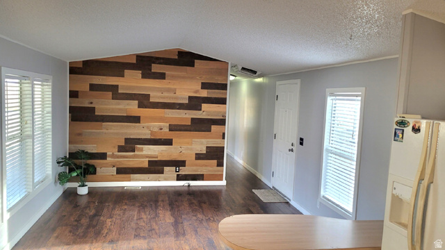 1525 South 400 East, Unit 63 Springville, UT 84663 - Photo 16 of 36 Entrance foyer featuring wood walls, dark wood-style floors, and an accent wall
