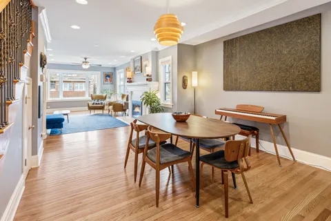 a view of a dining room with furniture and wooden floor