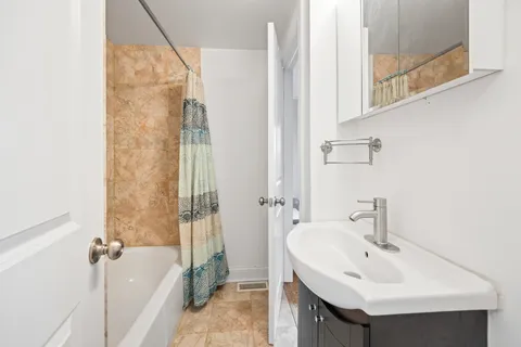 a bathroom with a sink and a bathtub