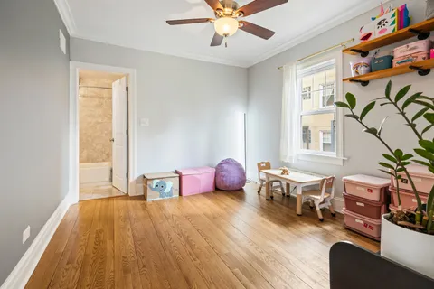 a bedroom with furniture and a window