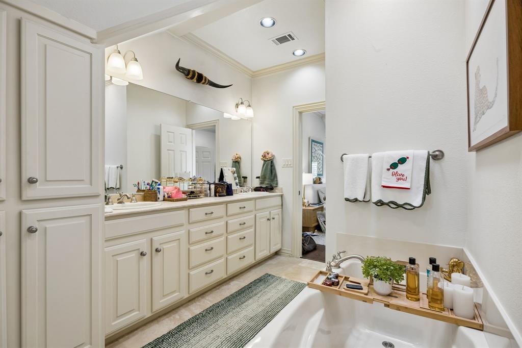 3101 Rosedale Avenue, Unit D University Park, TX 75205 - Photo 15 of 23 a spacious bathroom with a double vanity sink and a mirror