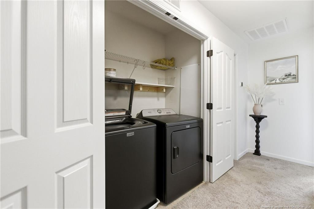 334 Crane Way Bunnlevel, NC 28323 - Photo 25 of 45 a kitchen with stainless steel appliances granite countertop a refrigerator and a stove