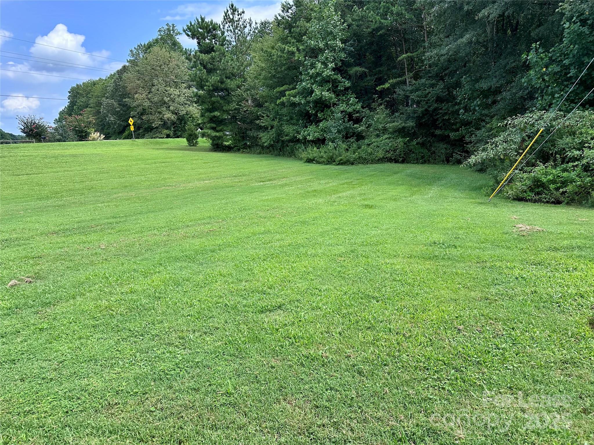 1536 Beth Haven Church Road Denver, NC 28037 - Photo 11 of 11 a view of field with trees in the background