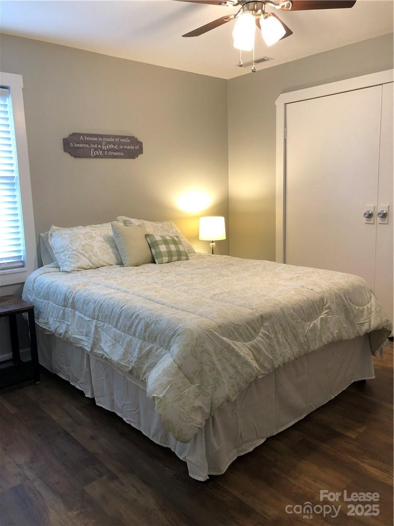 1536 Beth Haven Church Road Denver, NC 28037 - Photo 4 of 11 a bedroom with a bed and a chandelier