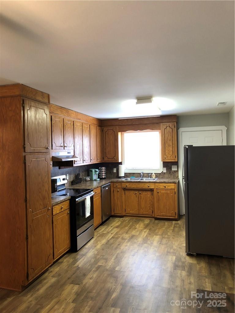 1536 Beth Haven Church Road Denver, NC 28037 - Photo 5 of 11 a kitchen with stainless steel appliances granite countertop a refrigerator and a stove