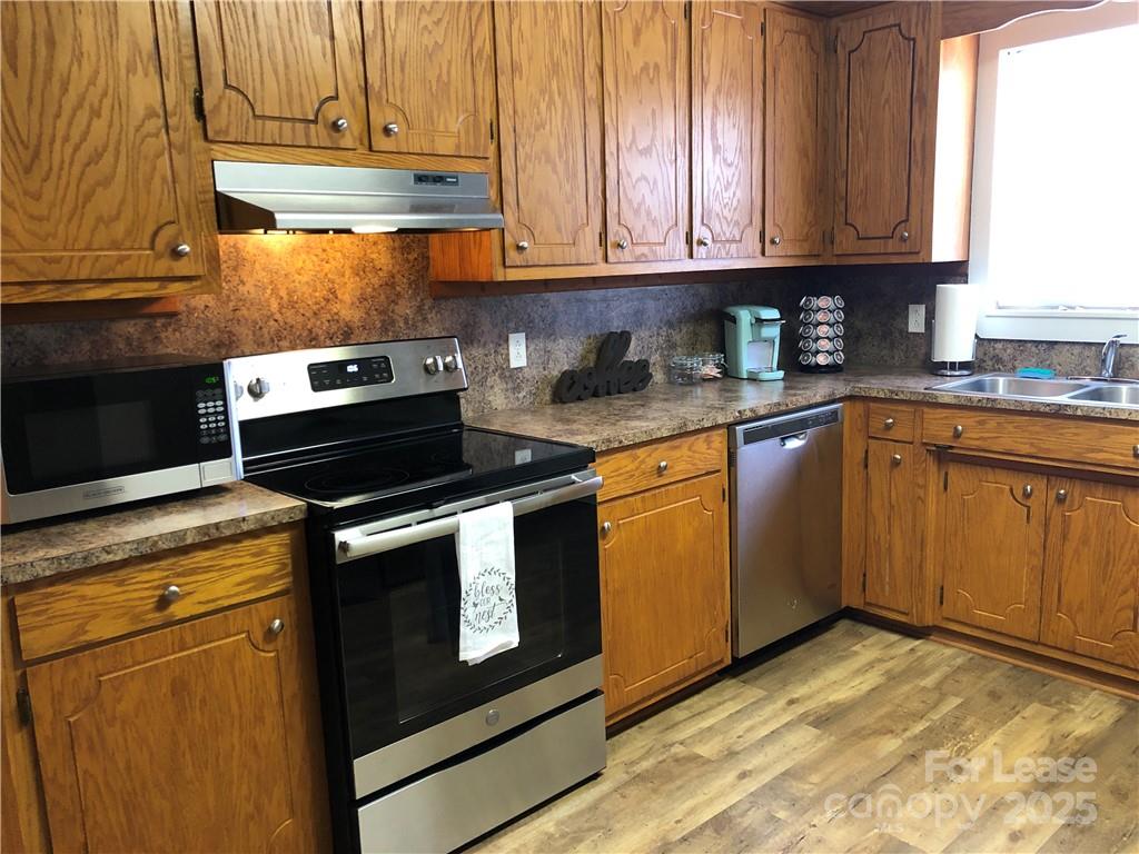 1536 Beth Haven Church Road Denver, NC 28037 - Photo 7 of 11 a kitchen with granite countertop cabinets stainless steel appliances and a sink