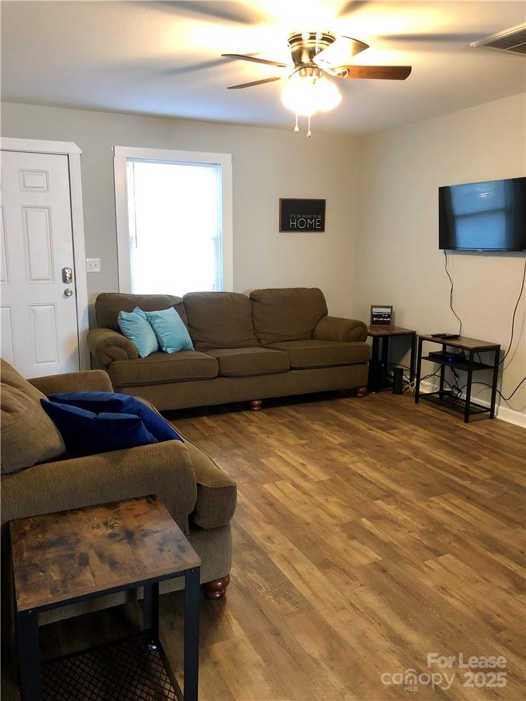 1536 Beth Haven Church Road Denver, NC 28037 - Photo 8 of 11 a living room with furniture and a wooden floor