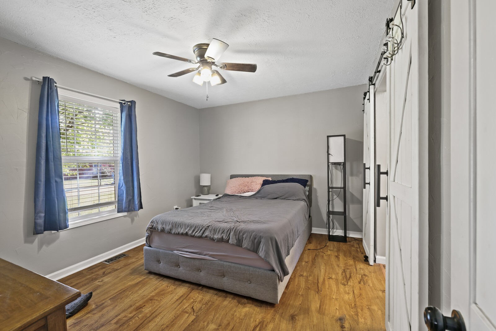 408 Magnolia Street Baxter, TN 38544 - Photo 15 of 44 a spacious bedroom with a bed and a window