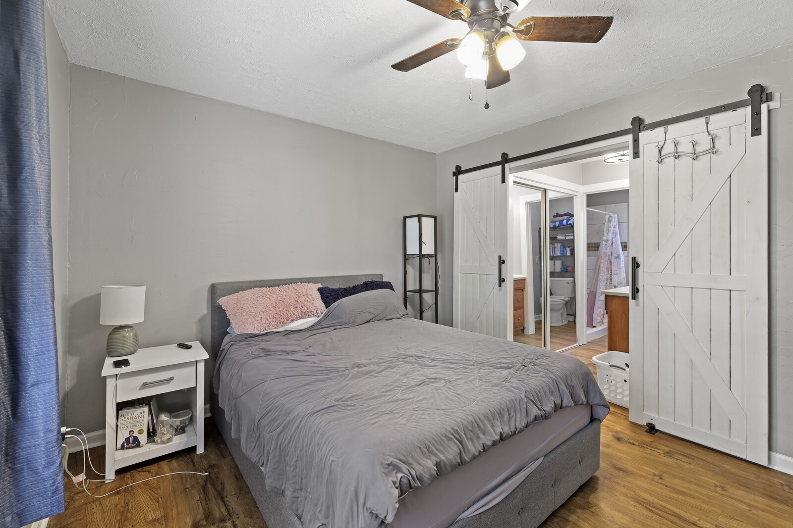 408 Magnolia Street Baxter, TN 38544 - Photo 16 of 44 a bedroom with a bed window and a ceiling fan