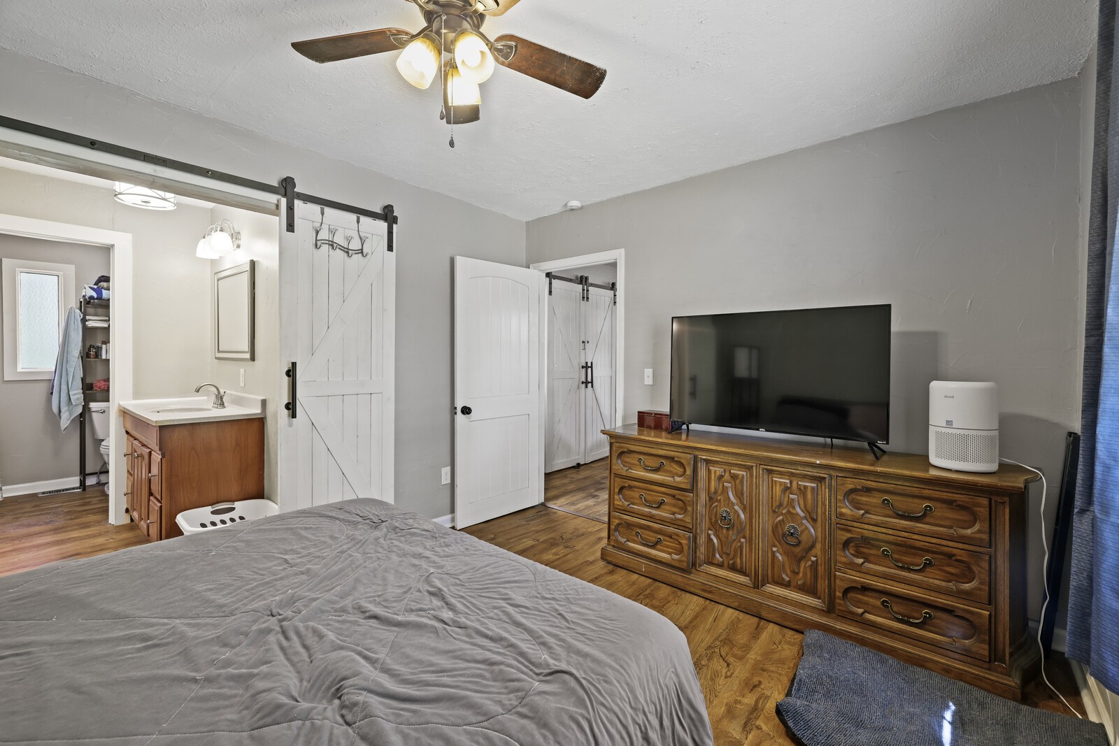 408 Magnolia Street Baxter, TN 38544 - Photo 17 of 44 a bedroom with a bed and a flat screen television