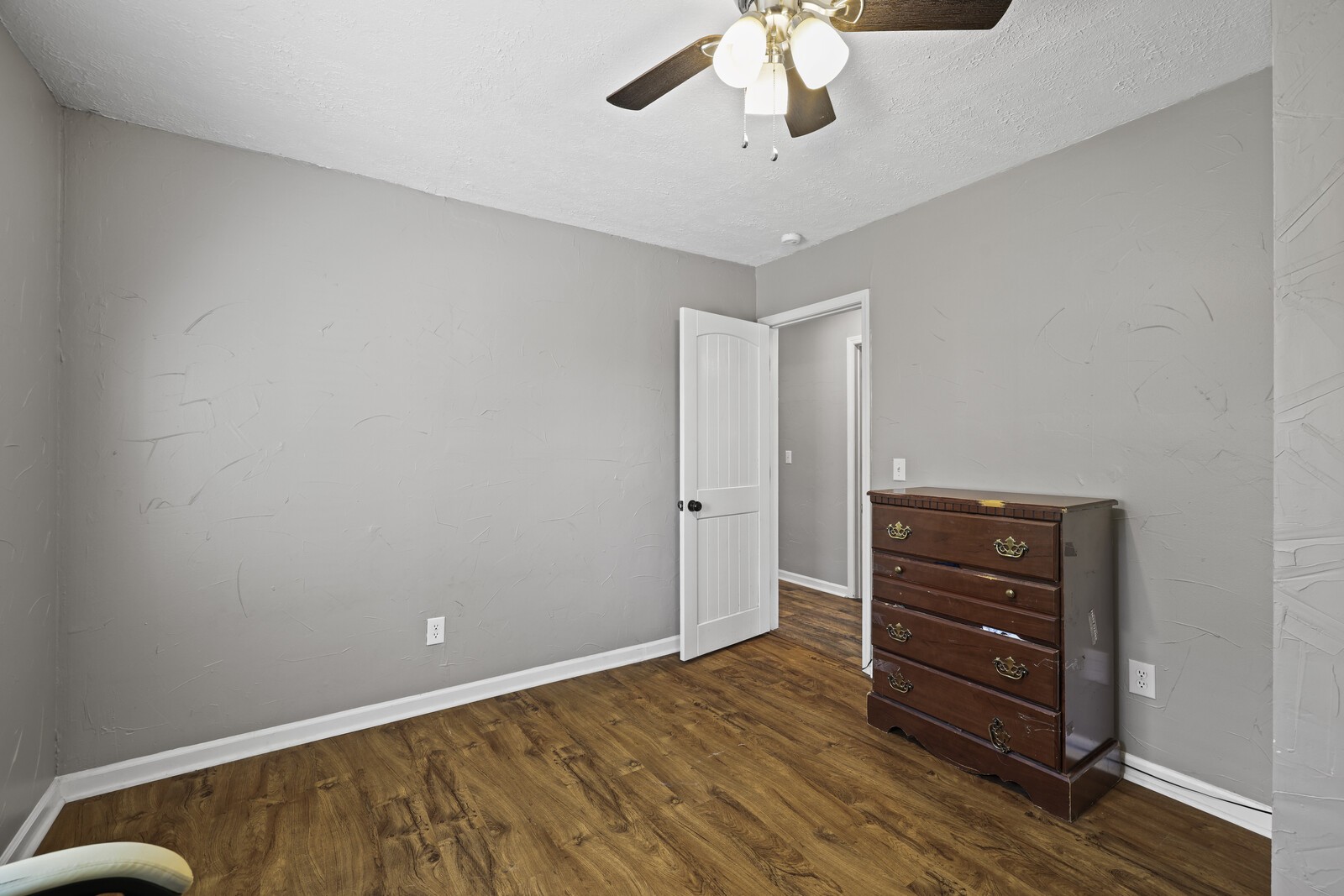 408 Magnolia Street Baxter, TN 38544 - Photo 22 of 44 a view of room with wooden floor and ceiling fan