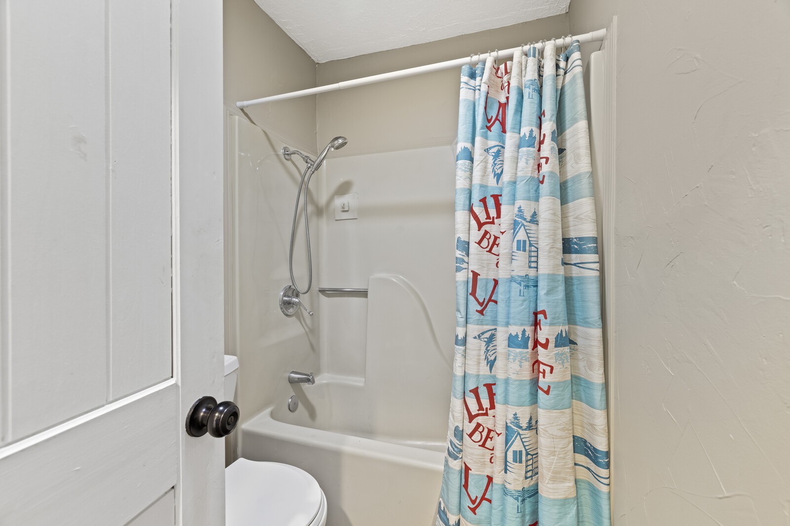 408 Magnolia Street Baxter, TN 38544 - Photo 27 of 44 a bathroom with a bathtub and a shower curtain