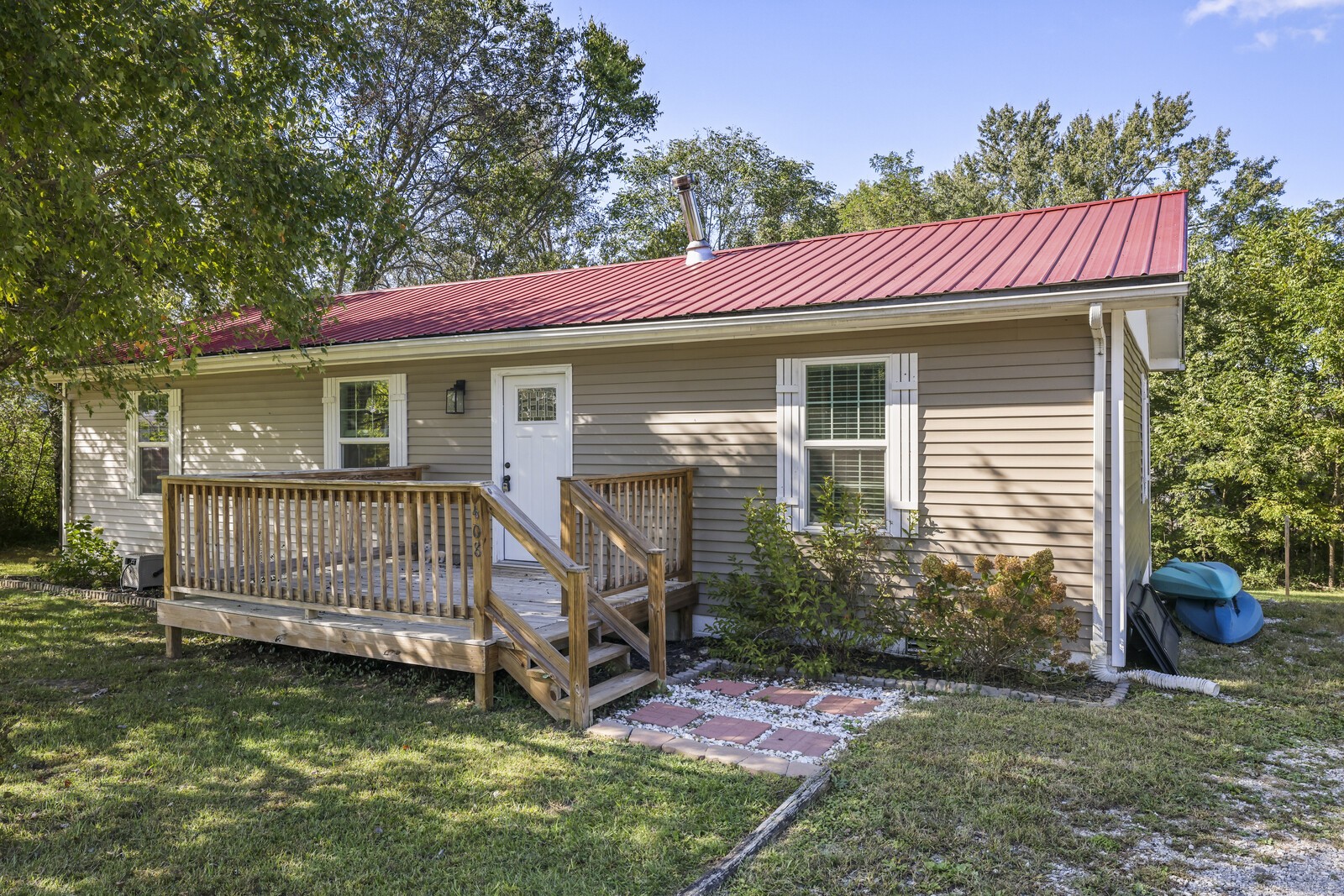 408 Magnolia Street Baxter, TN 38544 - Photo 3 of 44 a view of a house with a yard