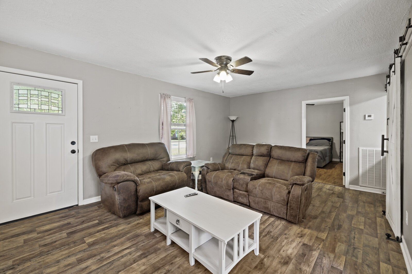 408 Magnolia Street Baxter, TN 38544 - Photo 5 of 44 a living room with furniture and a wooden floor