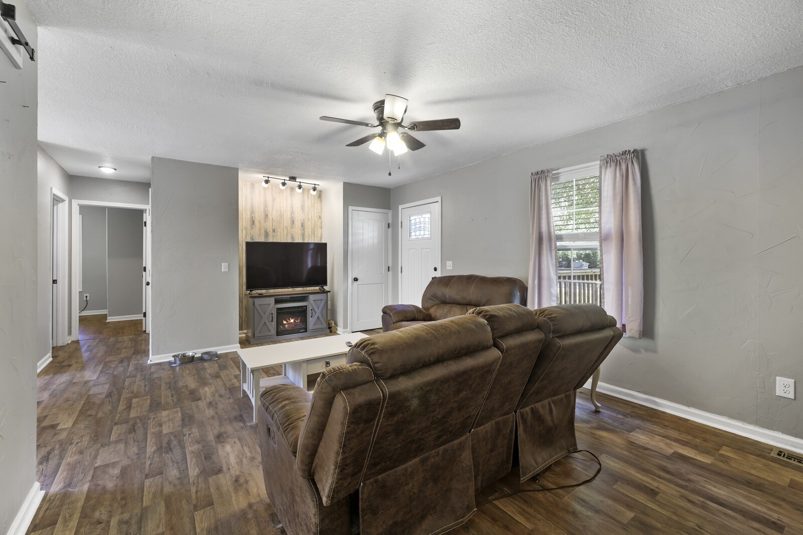 408 Magnolia Street Baxter, TN 38544 - Photo 6 of 44 a living room with furniture and a flat screen tv