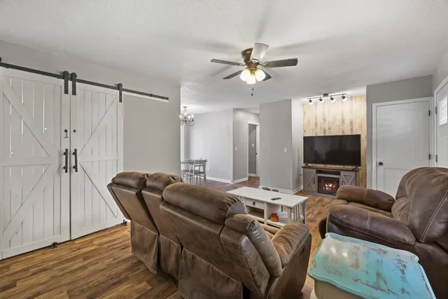 a living room with furniture and a flat screen tv