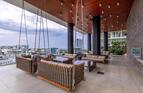 a view of a patio with couches and potted plants