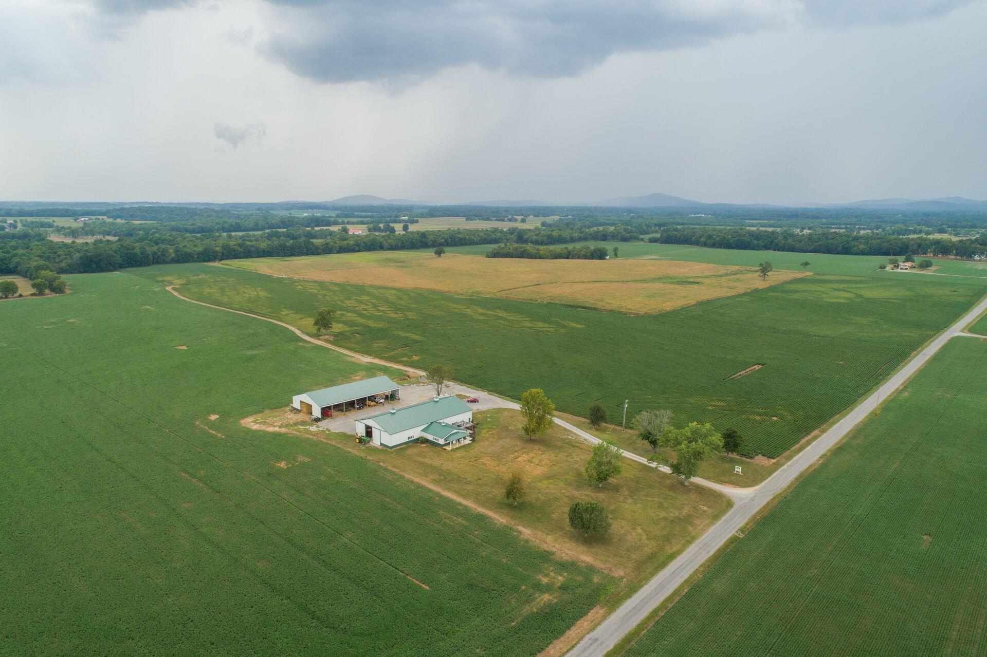 159 County Line Road Bell Buckle, TN 37020 - Photo 20 of 28 a view of a lake with a big yard