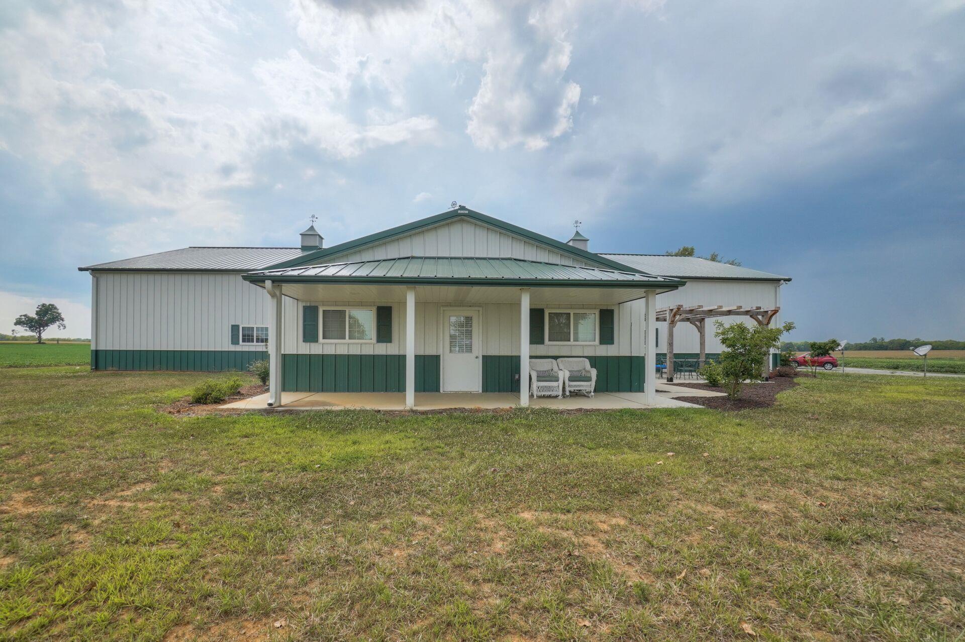 159 County Line Road Bell Buckle, TN 37020 - Photo 3 of 28 a view of a house with a swimming pool and a yard