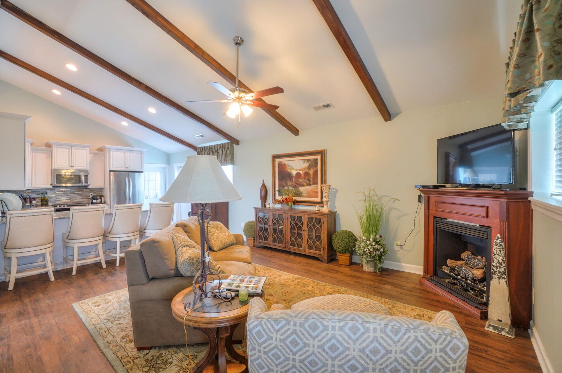 159 County Line Road Bell Buckle, TN 37020 - Photo 5 of 28 a living room with furniture a fireplace and a flat screen tv