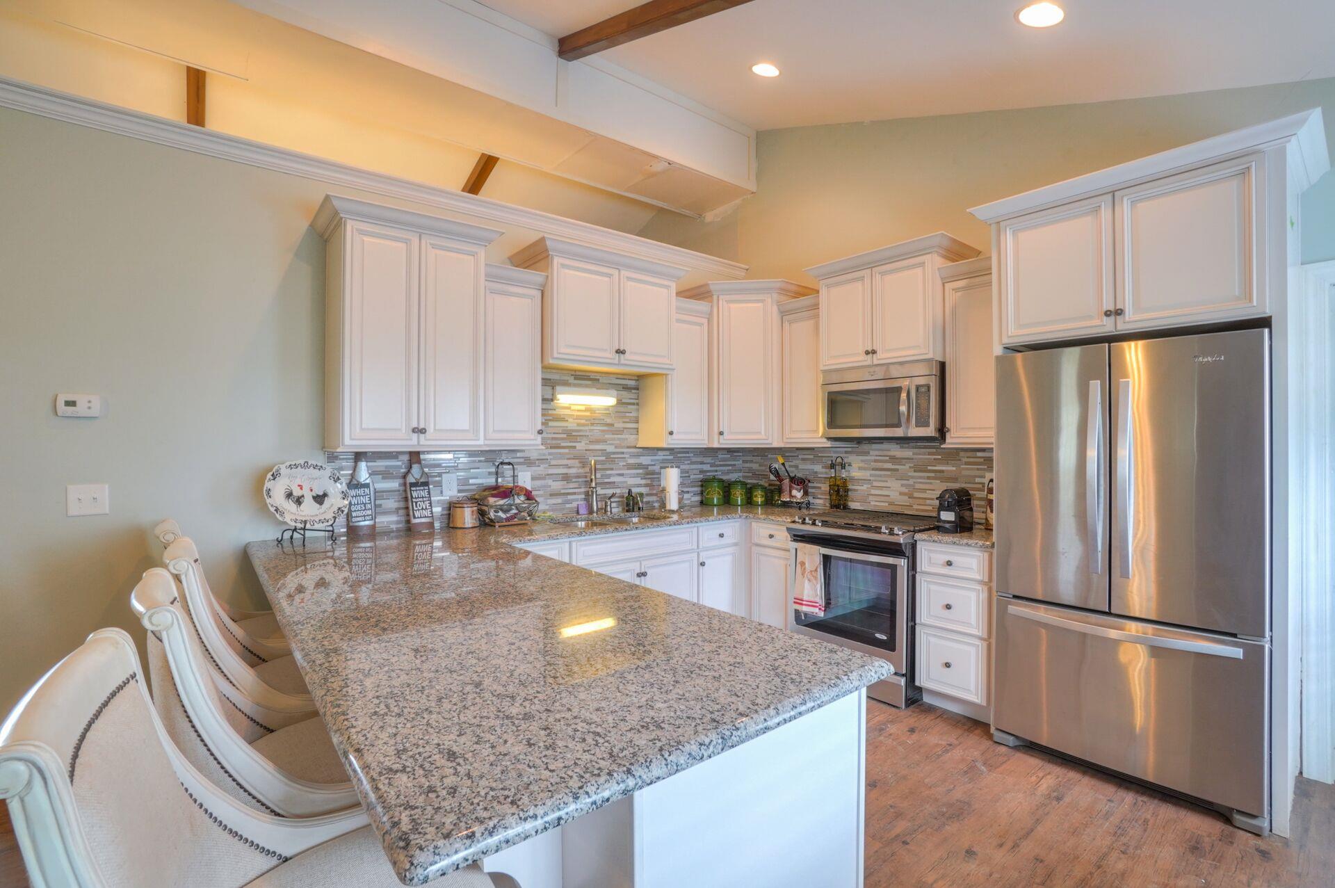 159 County Line Road Bell Buckle, TN 37020 - Photo 7 of 28 a kitchen with stainless steel appliances granite countertop a refrigerator a sink a stove a microwave and island
