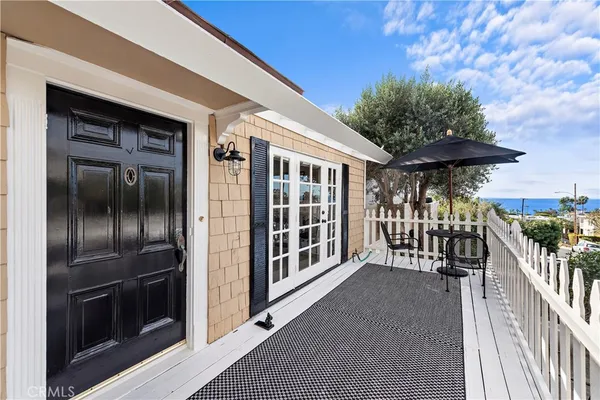a view of a porch with a floor to ceiling window