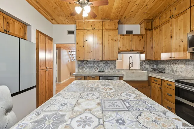 a large kitchen with cabinets