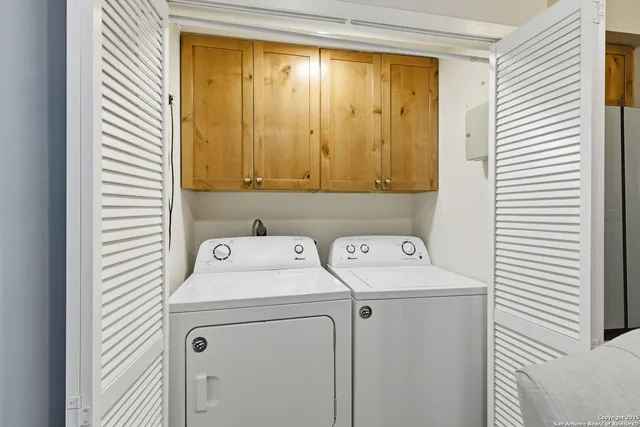 a utility room with dryer and washer