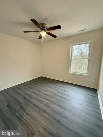 a view of empty room with windows