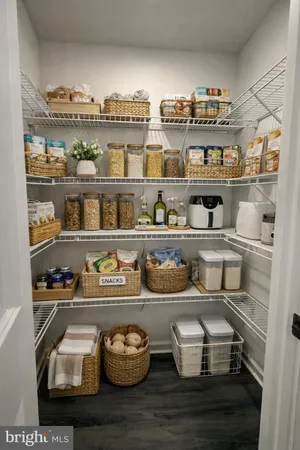 a shelf with cup and plates