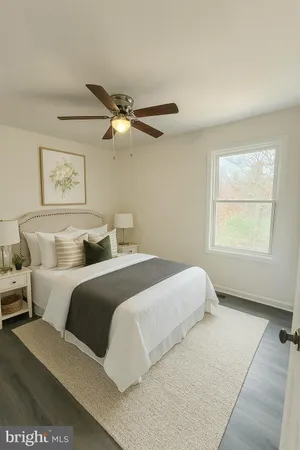 a bedroom with a large bed and a window