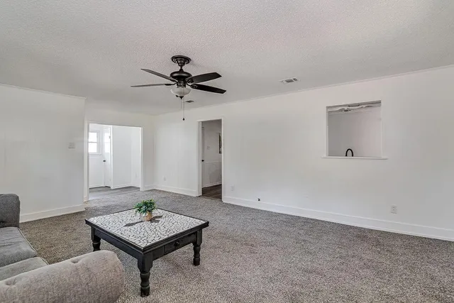 a room that has a table and a chair in it