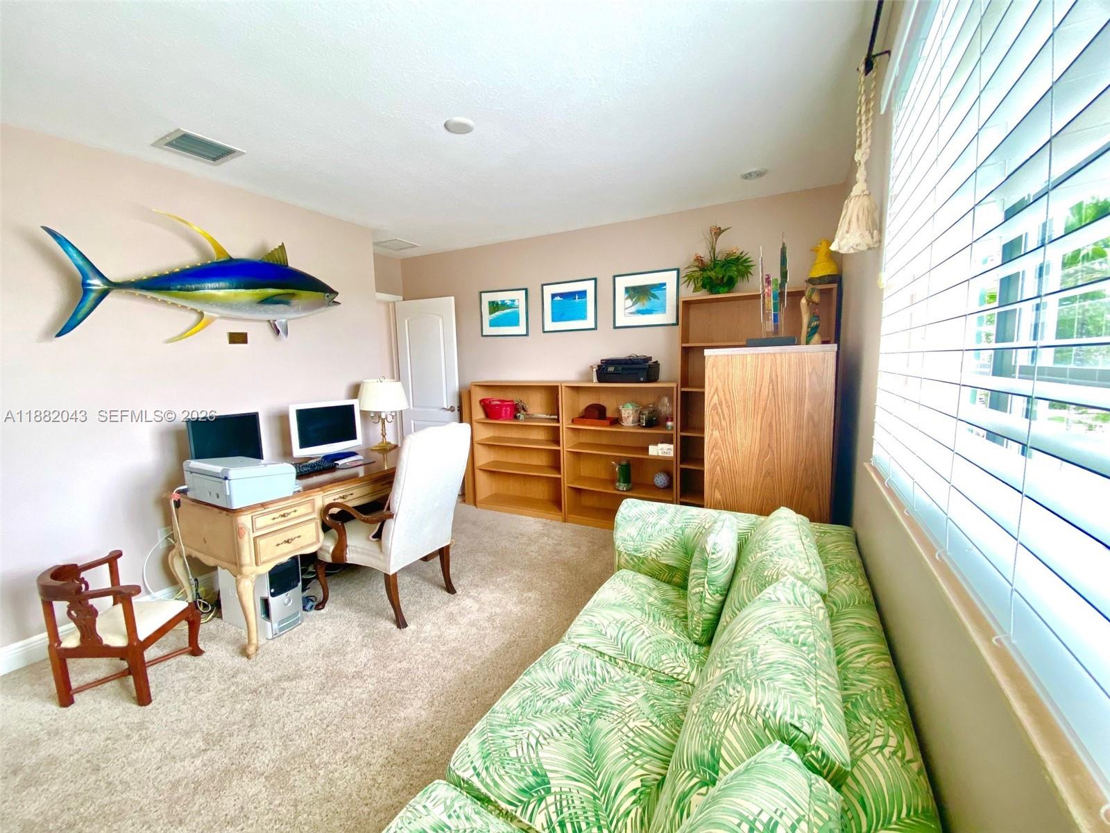7702 Paddock Place, Unit 7702 Davie, FL 33328 - Photo 15 of 55 a living room with furniture and a large window