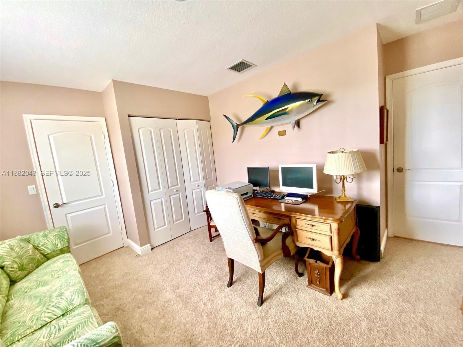 7702 Paddock Place, Unit 7702 Davie, FL 33328 - Photo 16 of 55 a living room with furniture and a window