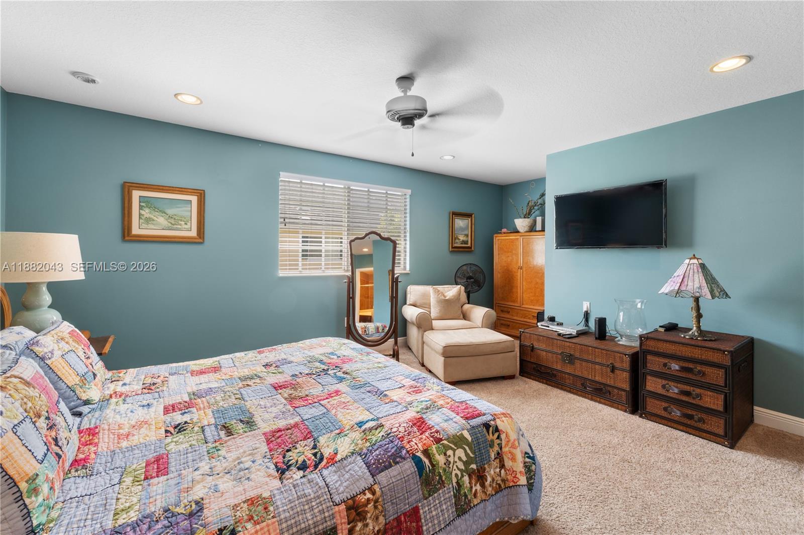 7702 Paddock Place, Unit 7702 Davie, FL 33328 - Photo 18 of 55 a bedroom with bed and a flat screen tv