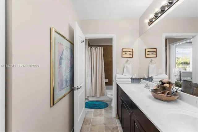 an aerial view of a house with a swimming pool and garden