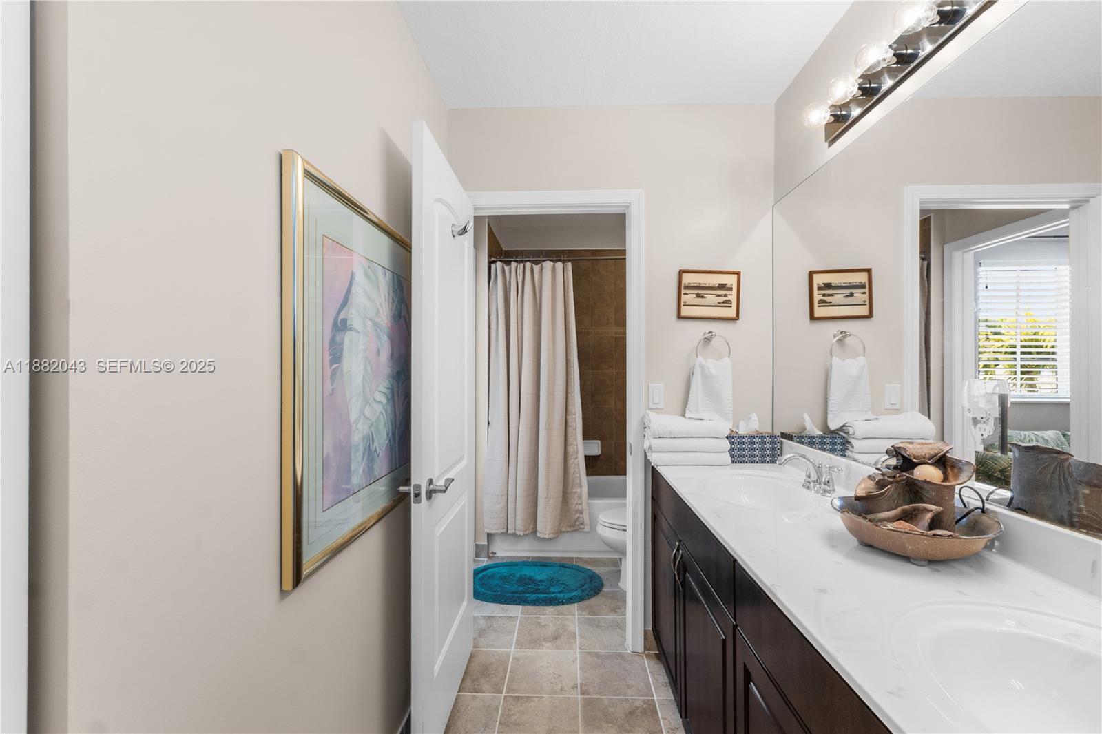 7702 Paddock Place, Unit 7702 Davie, FL 33328 - Photo 19 of 55 a kitchen with stainless steel appliances a sink stove and refrigerator