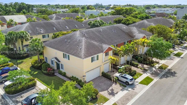 an aerial view of a house with a garden