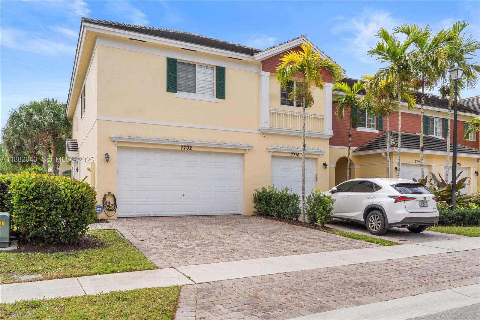 7702 Paddock Place, Unit 7702 Davie, FL 33328 - Photo 38 of 55 a front view of a house with garden