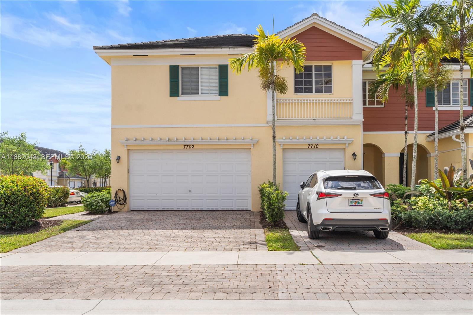7702 Paddock Place, Unit 7702 Davie, FL 33328 - Photo 40 of 55 a view of a car park side of the road
