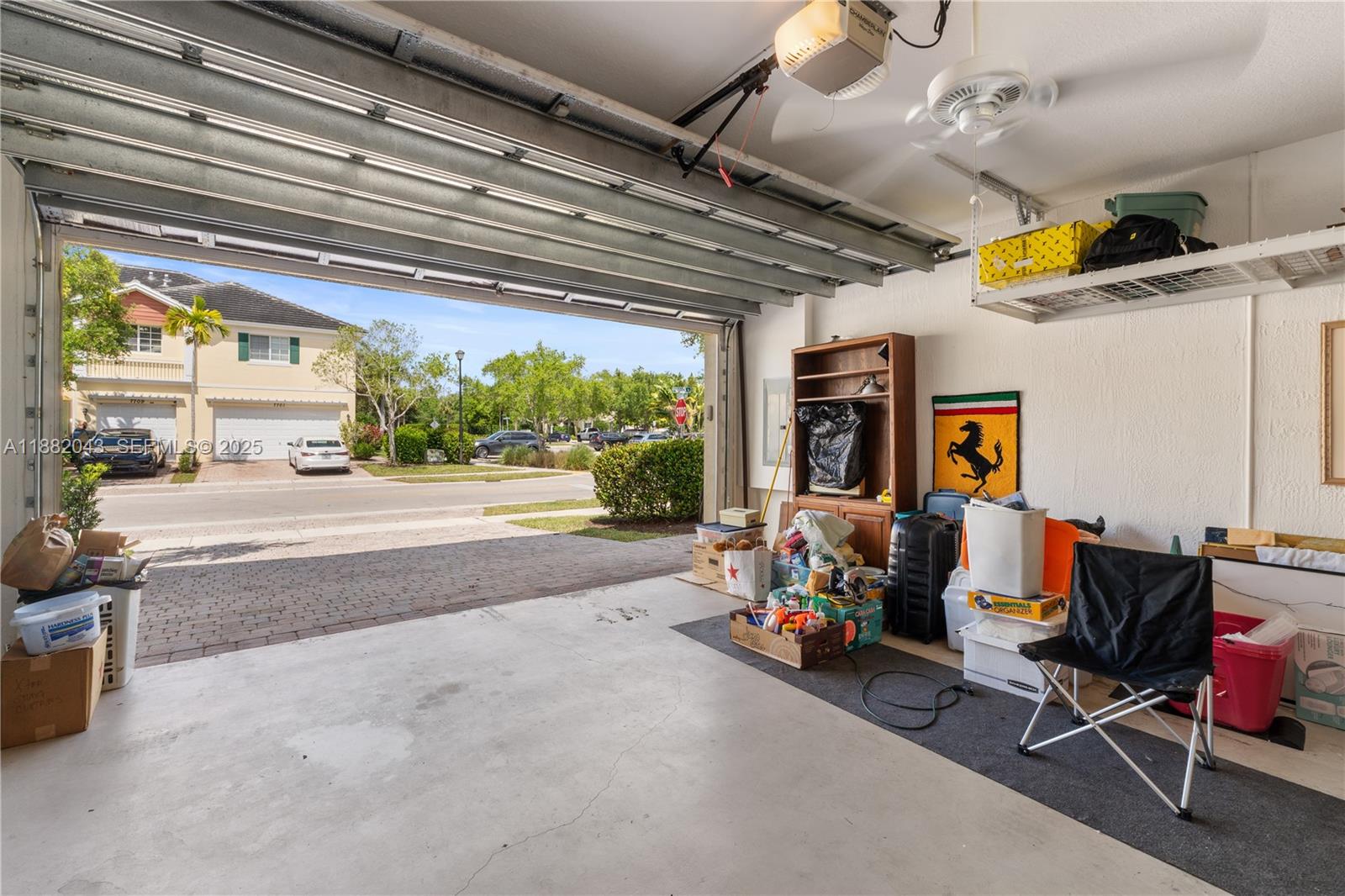 7702 Paddock Place, Unit 7702 Davie, FL 33328 - Photo 42 of 55 a living room with furniture and a large window